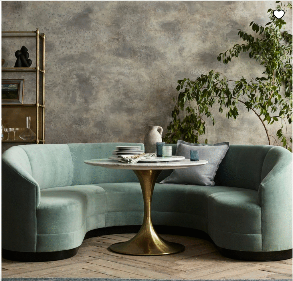 upholstered banquette dining seating with a round table.